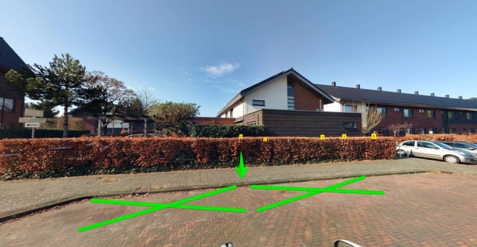 2 getekende groene kruisen waar laadpaal komt