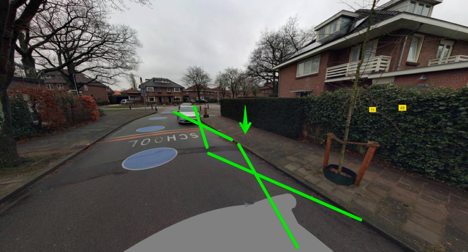 2 getekende groene kruisen op de plek waar laadplek moet komen