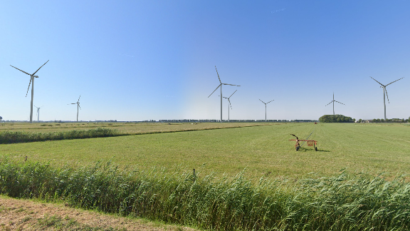 Afbeelding 5.26 Visualisatie 3, bovengrens. Positionering aan de Zilverlandseweg ten noorden van de infrastructurele bundel. Zicht in westelijke richting